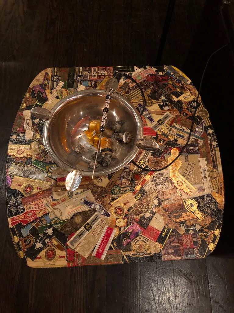 Cigar bands making up the top of a table! (Photo/Connor Coles)